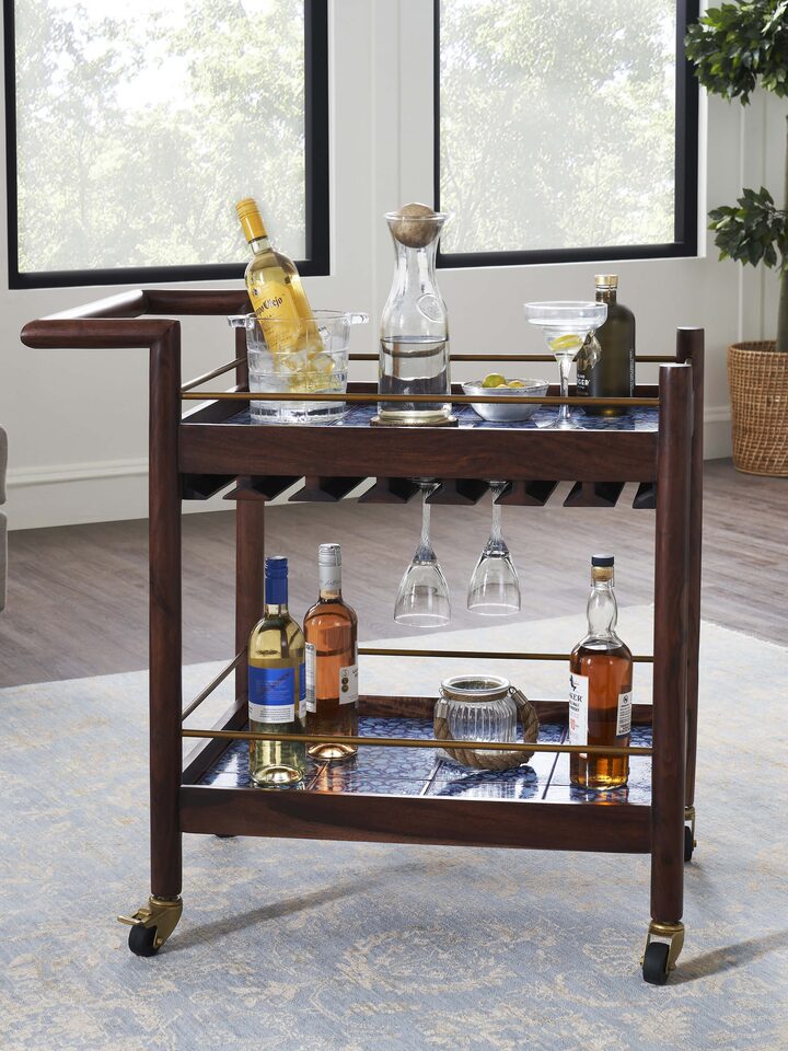 Side view of the Sheesham wood blue pottery bar trolley, highlighting the beautiful blue pottery accents and sturdy wood frame
