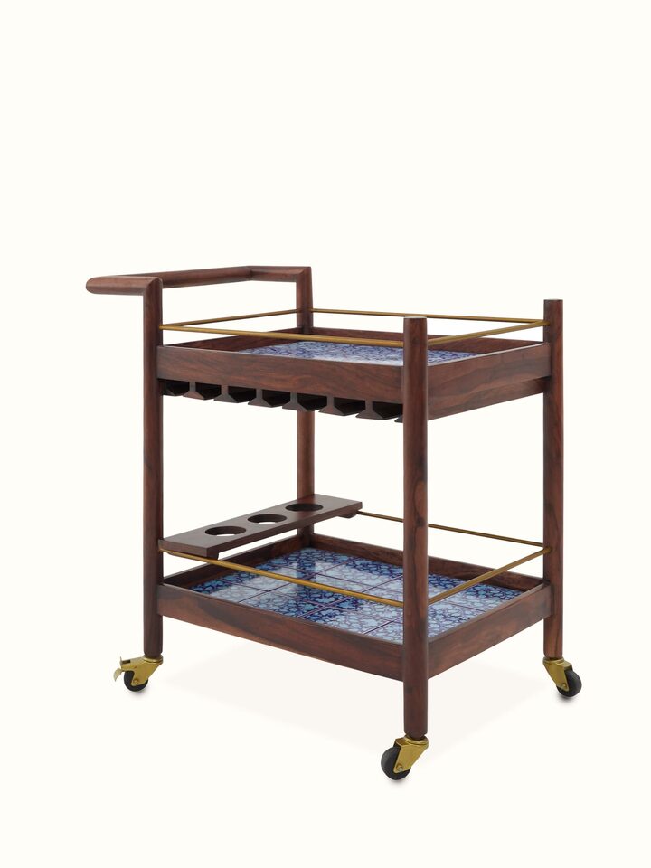 Close-up of the blue pottery details on the Sheesham wood bar trolley, emphasizing the intricate patterns and high-quality craftsmanship