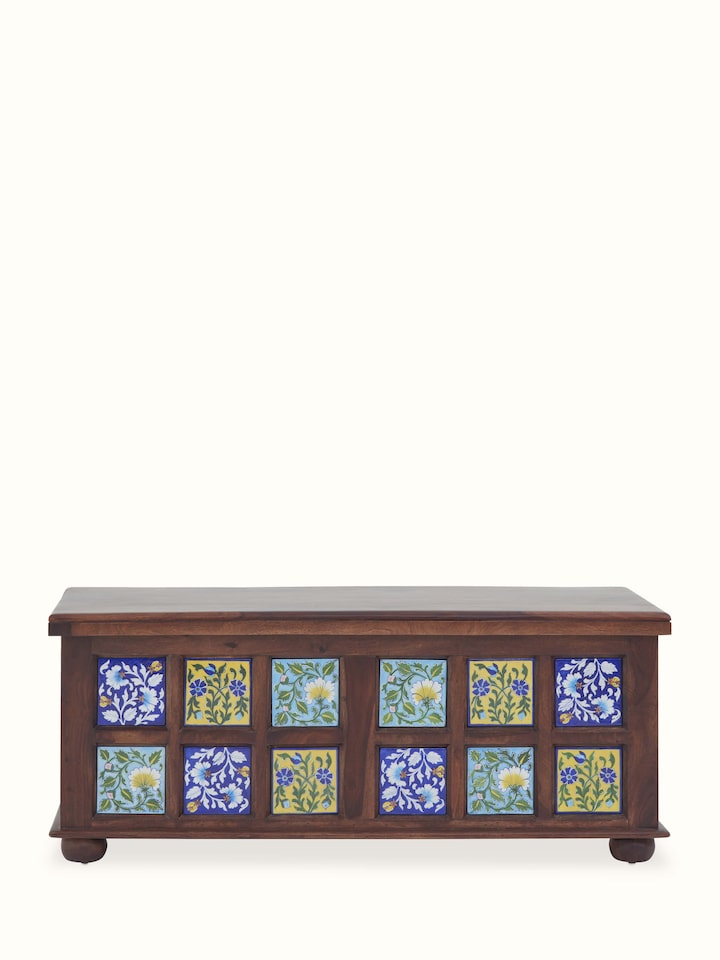 Sheesham wood trunk with intricate blue pottery design, highlighting the blend of traditional craftsmanship and vibrant blue patterns.