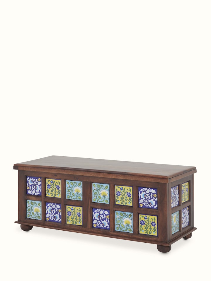 Top view of the Sheesham wood blue pottery trunk, displaying the detailed craftsmanship and vibrant patterns on the surface.