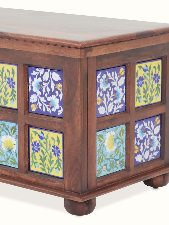 Detailed view of the blue pottery inlay on the Sheesham wood trunk, highlighting the intricate patterns and craftsmanship.