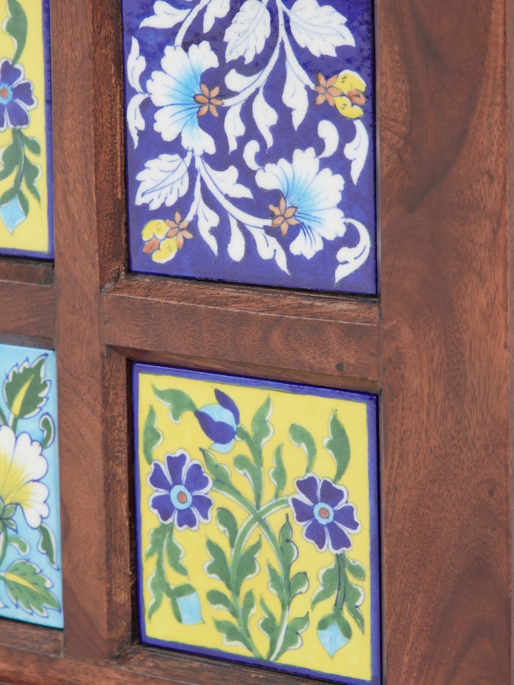 Sheesham wood trunk with blue pottery, showing the durability and elegant design suitable for traditional or modern interiors.