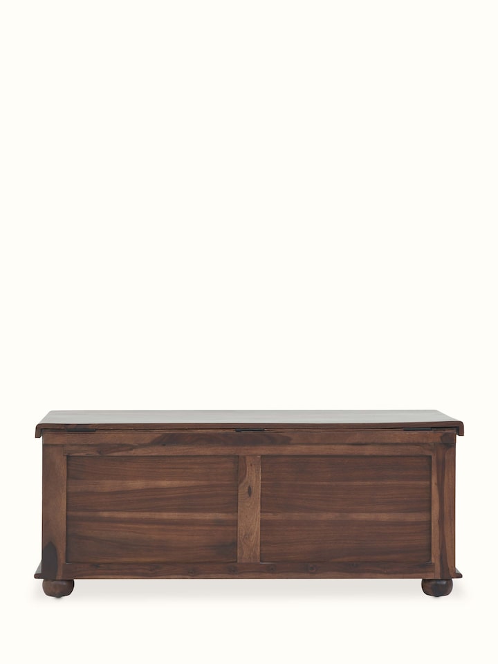 Blue pottery adorned Sheesham wood trunk with unique patterns, perfect for adding a touch of tradition and color to any space.