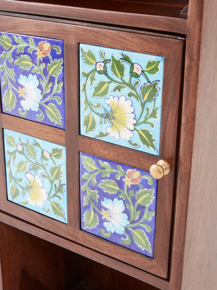 Angle view of Sheesham Wood Blue Pottery Wall Shelf with 1 door, showcasing the shelf's overall design and functionality