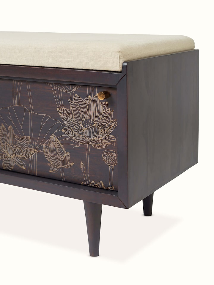 Angled view of Sheesham wood and brass Tarkashi bench, showing the bench's profile and brass detailing.