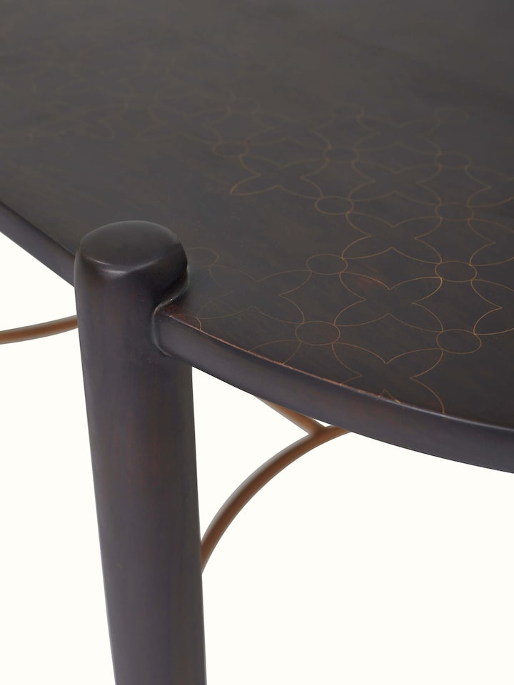 Detailed view of the brass tarkashi work on the Sheesham wood coffee table, highlighting the artistic inlay patterns.