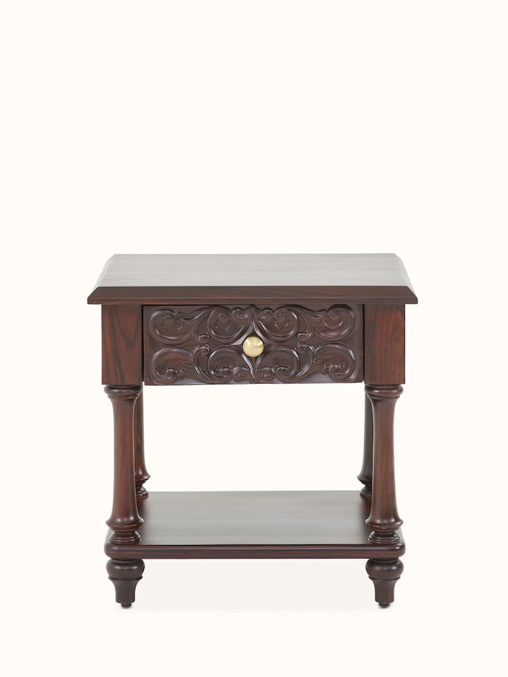 Front view of the carved rosewood bedside table, showcasing its intricate woodwork and elegant design.