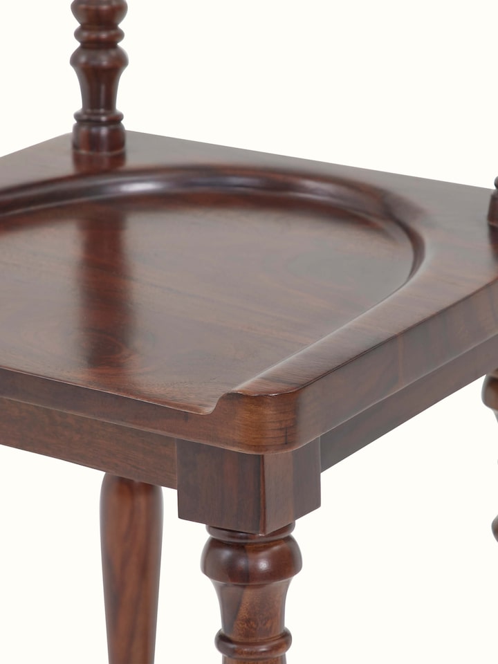 Detail view of Sheesham wood bar stool legs, illustrating the elegant design and durability.