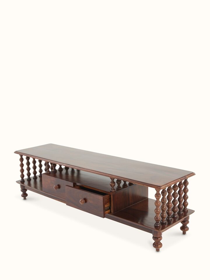 Detailed view of Sheesham wood entertainment unit’s storage compartments and design elements