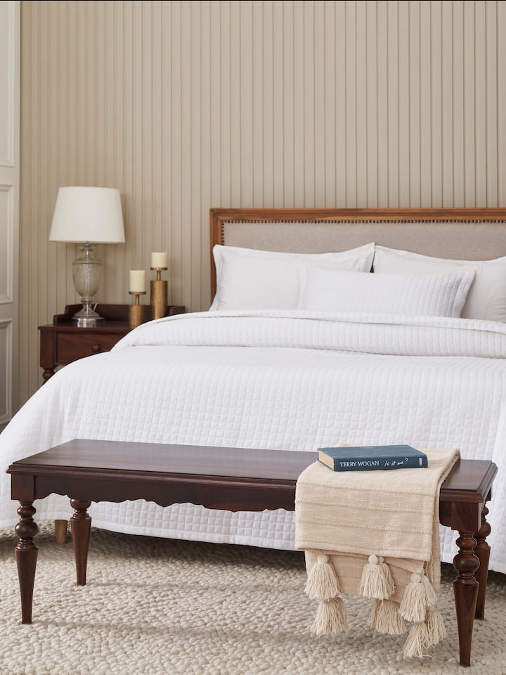 Side view of the Sheesham wood 2-seater bench, highlighting the craftsmanship and wood grain details.