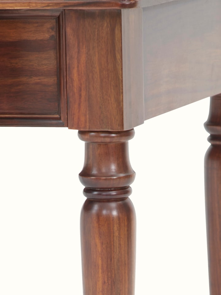 Angled view of the Sheesham wood study table, showing the depth and overall design of the piece