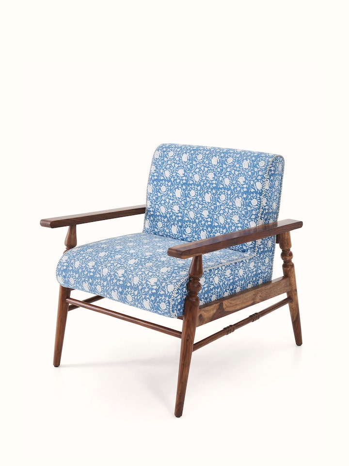 Close-up of the Sanganeri block print fabric on the Sheesham wood armchair, emphasizing the intricate patterns and colors.