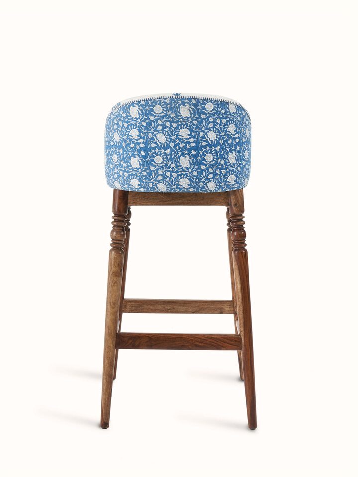 Side view of Sheesham wood Sanganeri block print bar chair showing the elegant block print pattern and traditional wood craftsmanship