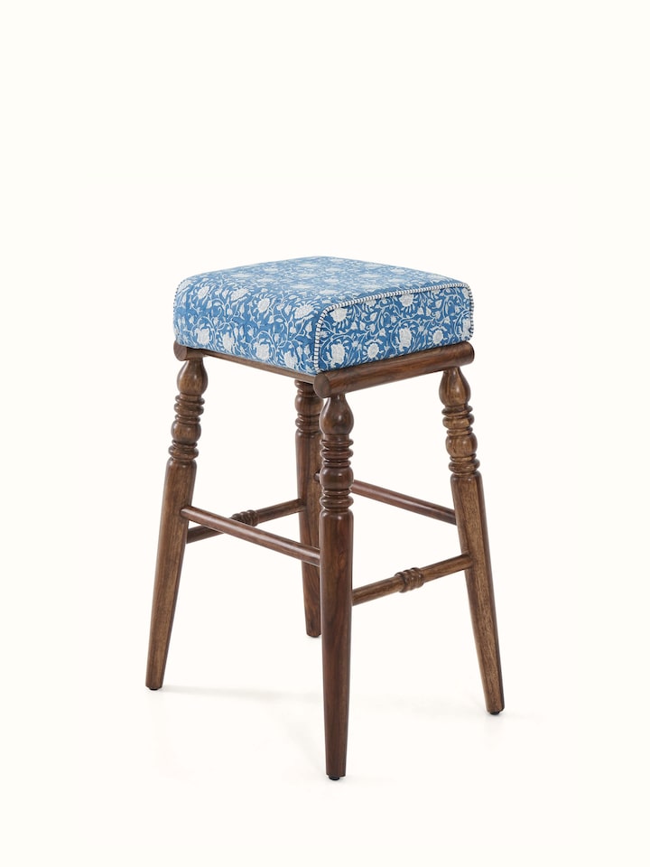 Close-up of the Sheesham wood bar stool with Sanganeri block print seat, emphasizing the intricate details and vibrant colors of the print.