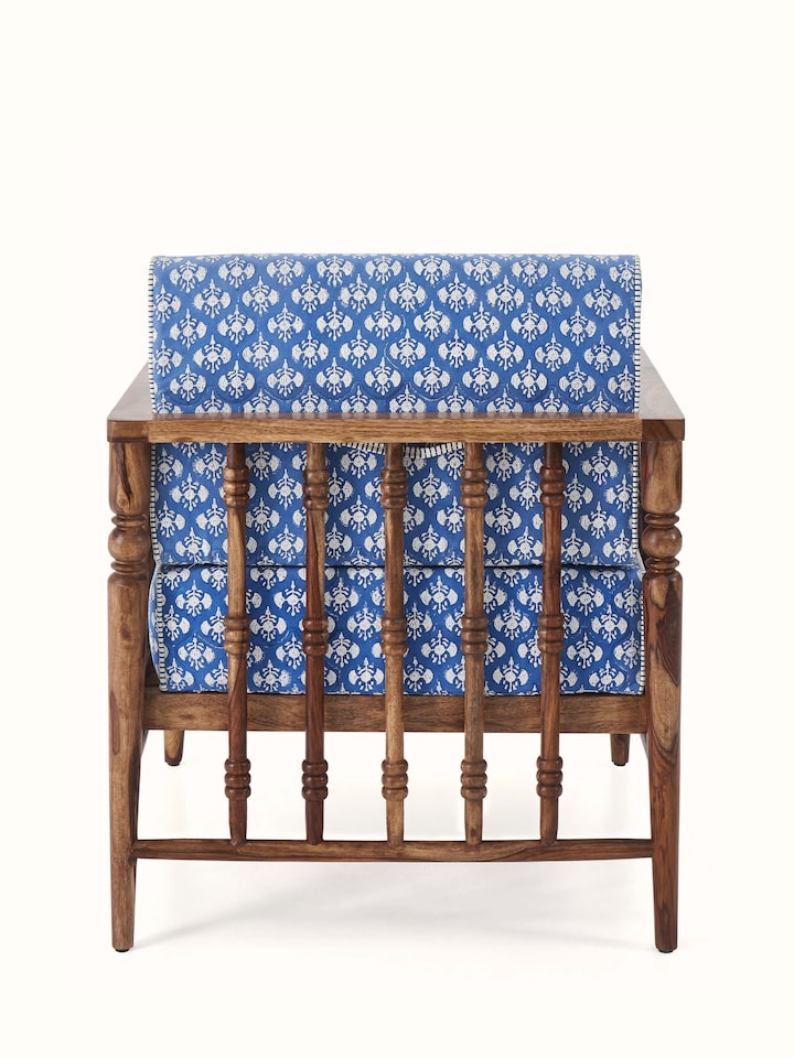 Side detail of Upholstered Sheesham Wood Sanganeri Block Print Lounge Chair showing its sleek, ergonomic design and comfortable armrests.
