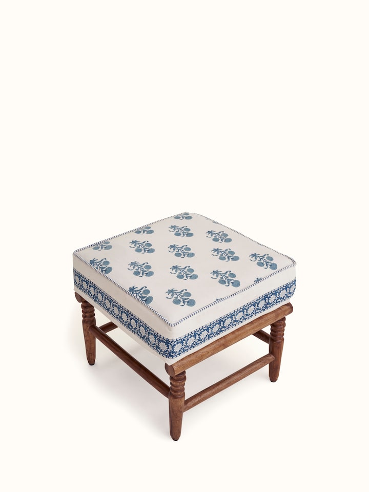 Angled view of the Sheesham wood Sanganeri block print ottoman, showcasing the artistic block print patterns and craftsmanship