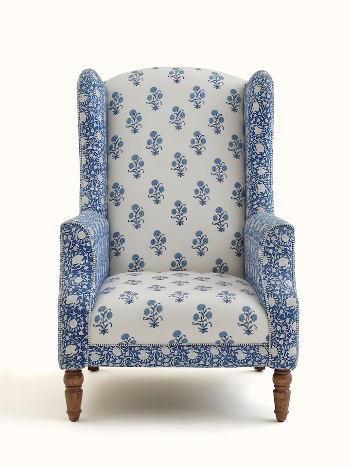 Front view of the upholstered Sheesham wood Sanganeri block print high back wing chair, showcasing the intricate block print design and high back