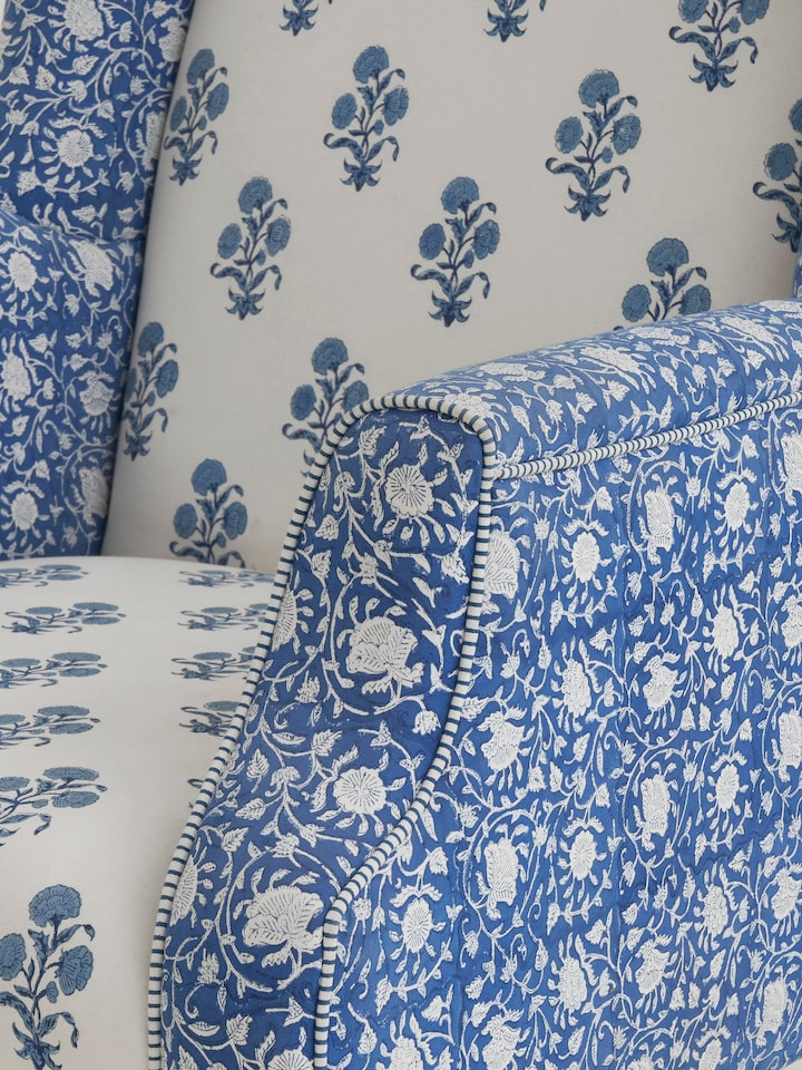 Another perspective of the upholstered Sheesham wood wing chair, highlighting the comfort and aesthetic appeal of the high back design