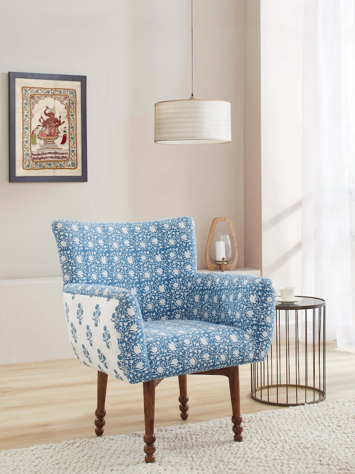Side view of Upholstered Sheesham Wood Sanganeri Block Print Wing Chair, highlighting the chair’s profile and wooden frame