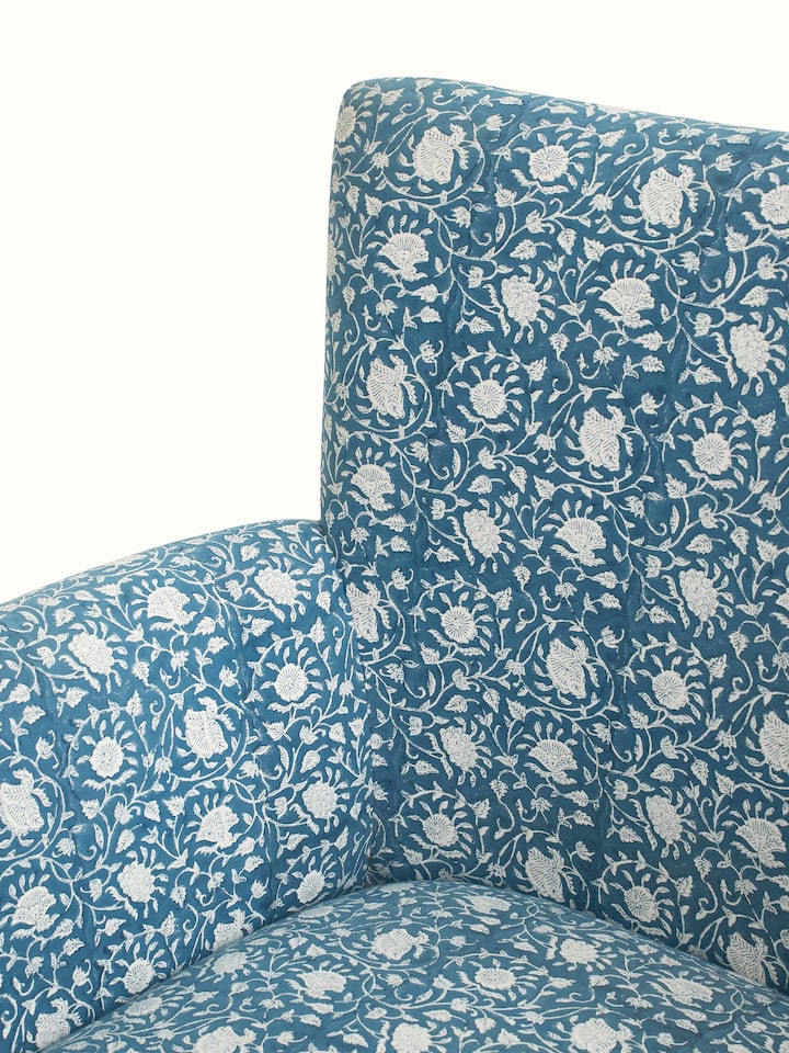 Detailed view of Upholstered Sheesham Wood Sanganeri Block Print Wing Chair’s backrest, showing the block print pattern and woodwork