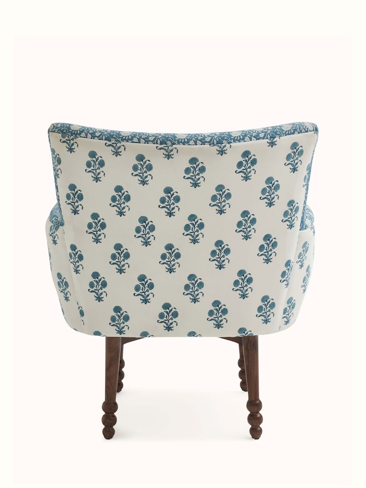 Close-up of the Sheesham wood details on Upholstered Sheesham Wood Sanganeri Block Print Wing Chair, focusing on the craftsmanship and finish
