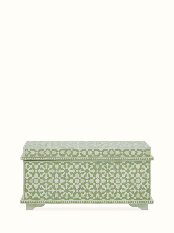 Front view of the bone inlaid trunk, showcasing the intricate bone inlay design and sturdy construction