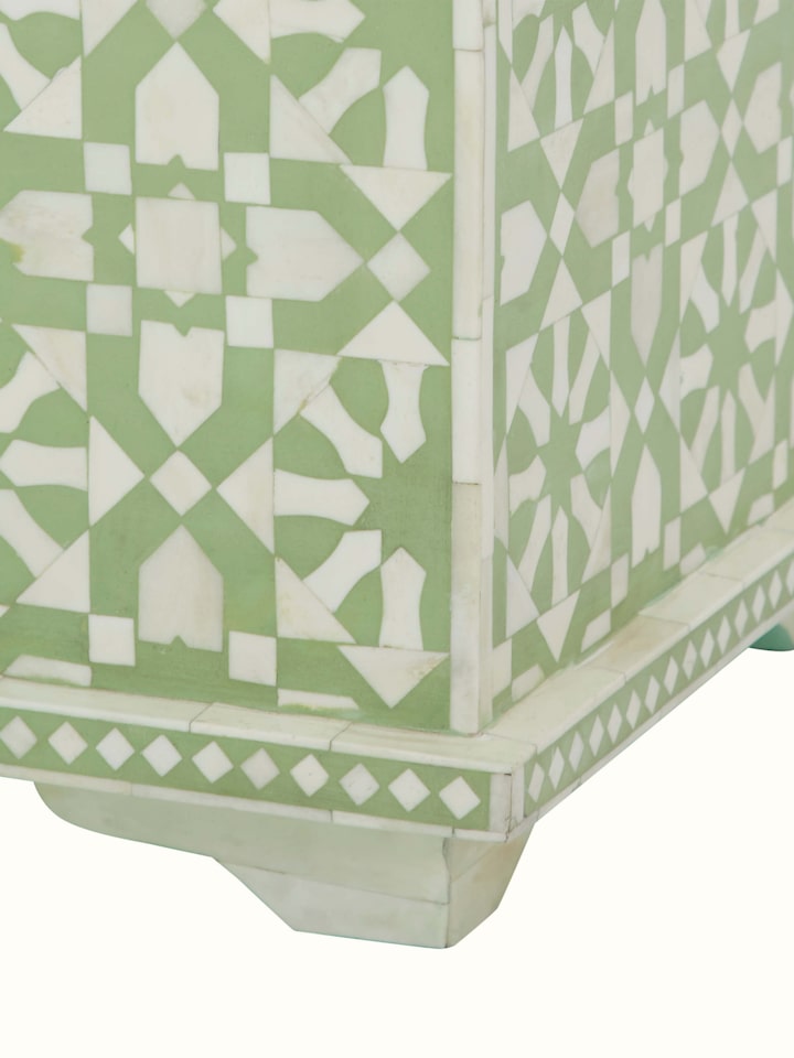 Close-up of the bone inlaid trunk, capturing the fine details of the bone inlay and the trunk's craftsmanship