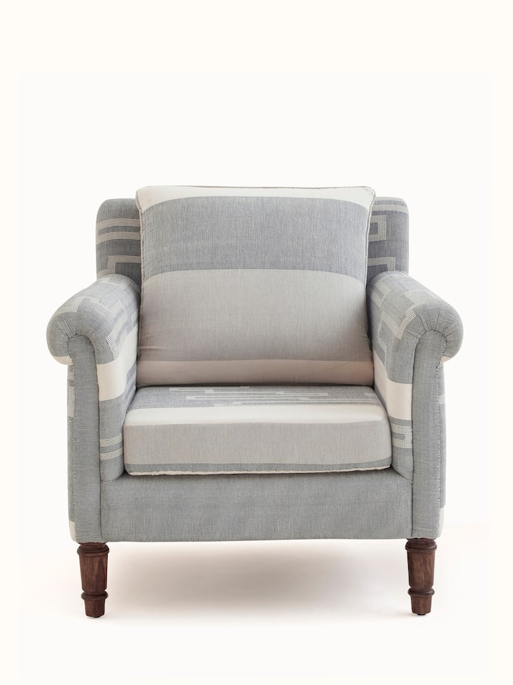 Front view of Sheesham Wood Bawan Buti Lounge Chair, showcasing the elegant design and intricate carvings