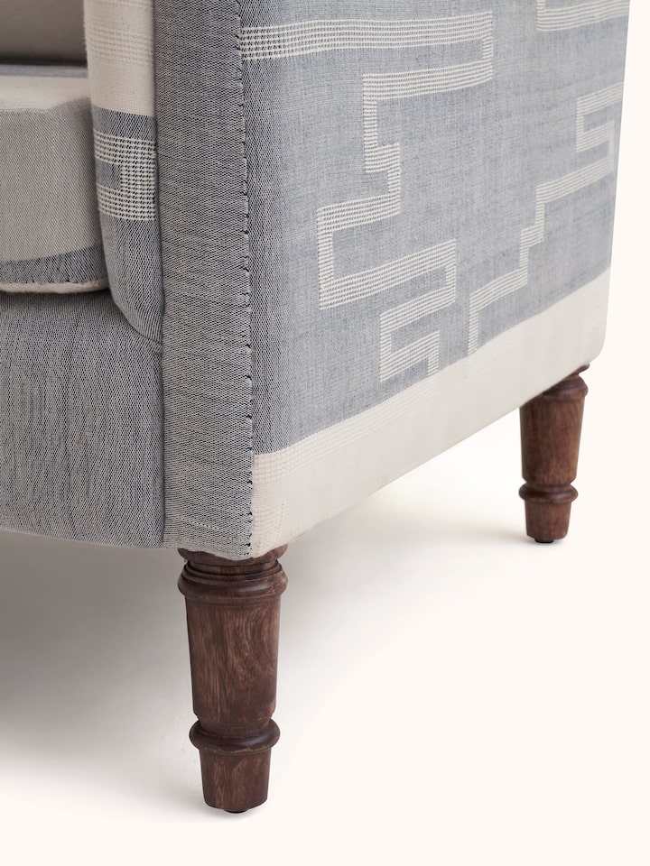 Angle view of Sheesham Wood Bawan Buti Lounge Chair, featuring the elegant lines and traditional design elements