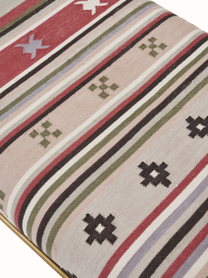 Rear view of the Panja Dhurrie upholstered Sheesham wood bench, showing the structural design and finish