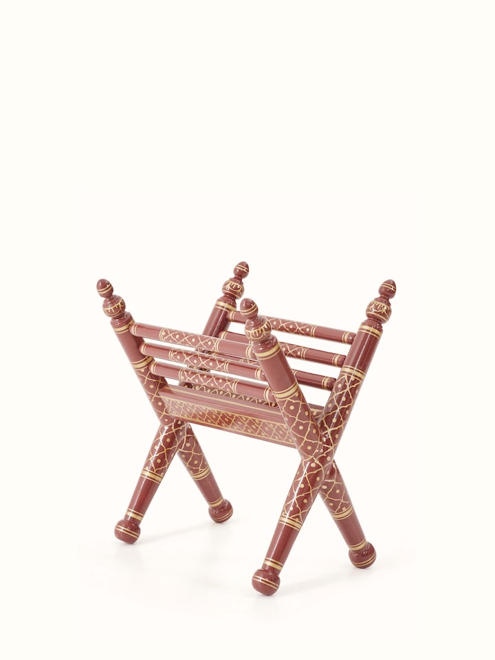 Close-up of Teak Wood Sankheda Cross Leg Magazine Rack, focusing on the texture and craftsmanship of the wood