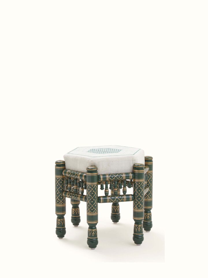 Bottom view of Upholstered teak wood Sankheda octagonal pouffe displaying intricate patterns