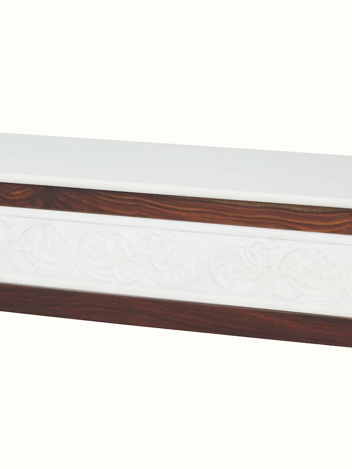 Close-up of the marble top of the walnut finish carved marble and Sheesham wood console table, emphasizing the marble’s texture and pattern