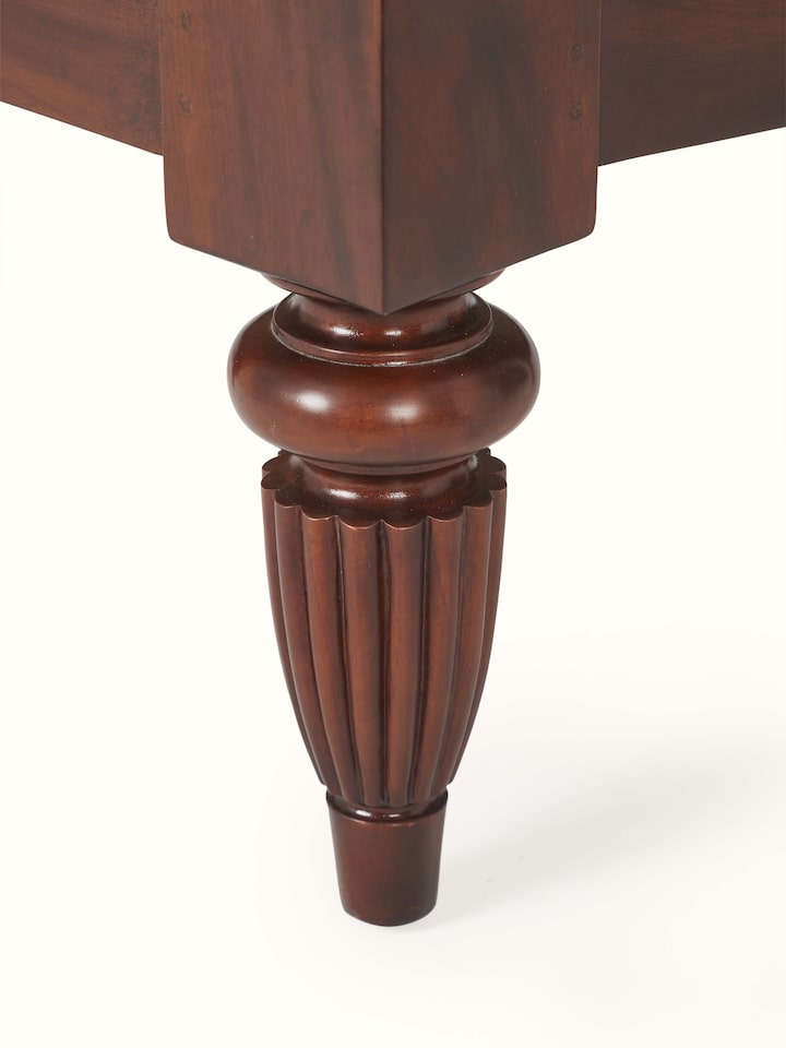 Angled view of upholstered mahogany wood & cane armchair, showing the combination of wood and cane details
