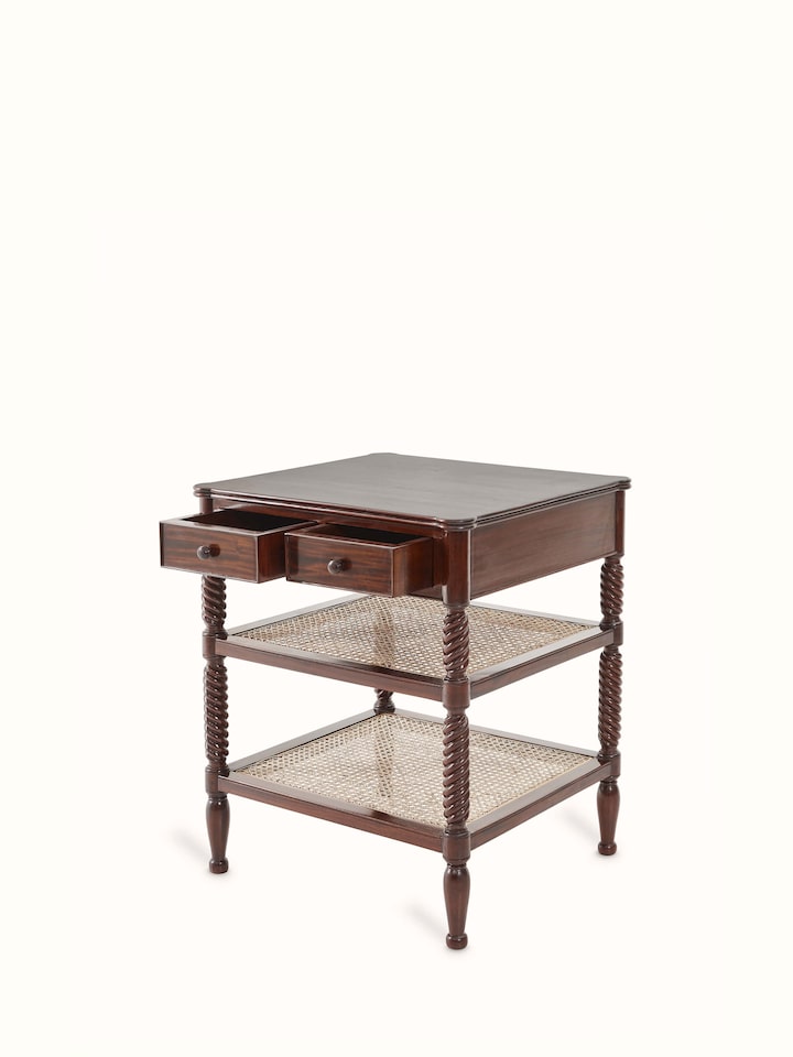 Close-up of the cane detailing on the mahogany wood and cane bedside table, highlighting the artisanal craftsmanship.