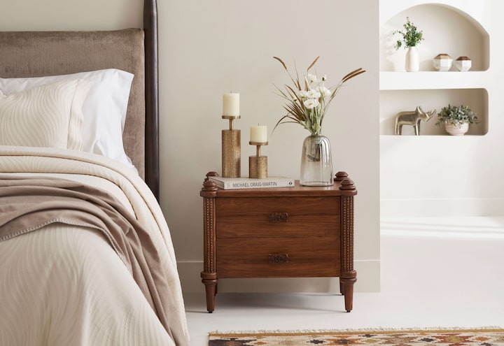 Side view of Carved Sheesham Wood Bedside Table highlighting its sleek design and fine craftsmanship.