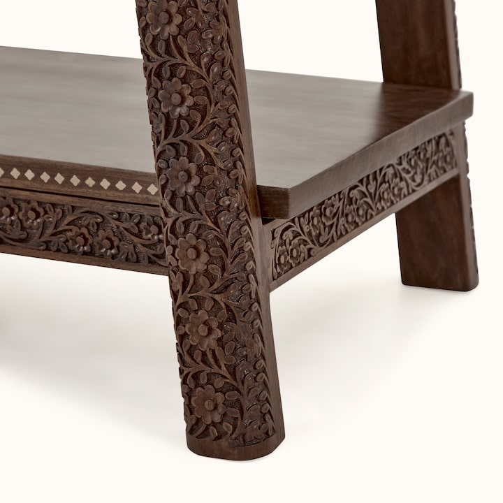 Top view of carved sheesham wood bookshelf, highlighting smooth finish and detailed carvings
