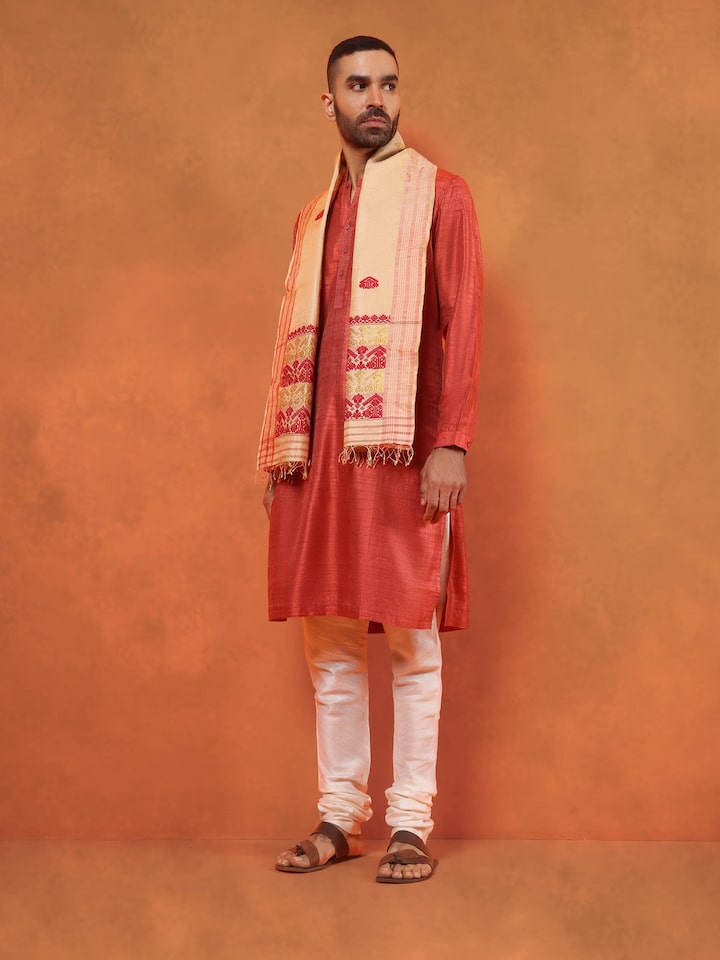 Lifestyle view of peach tussar silk stole draped elegantly over ethnic wear