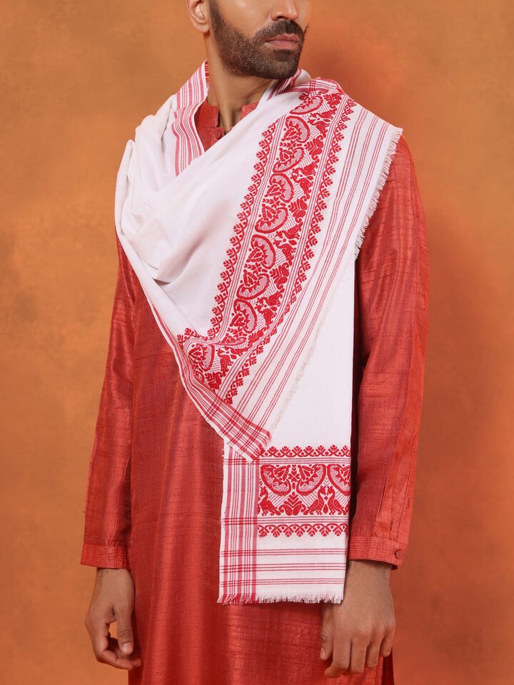Angled view of white stole showing soft creases and minimal aesthetic.
