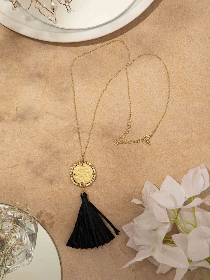 Top view of Raffia fibre long necklace displaying intricate patterns