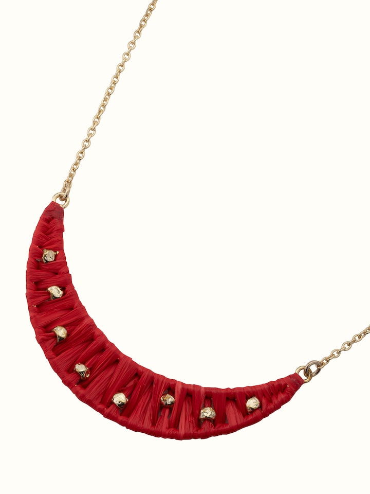 Angled view of raffia fibre long necklace showcasing its overall texture and style.