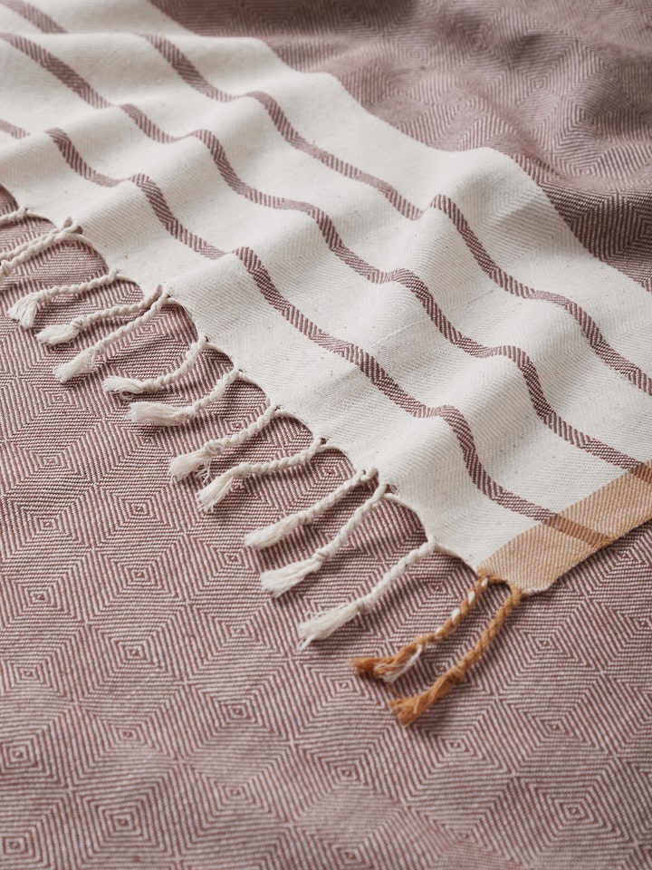 Close-up detail of Samitha red stripe cotton bath towel (M) showcasing the soft cotton fabric and stripe pattern.