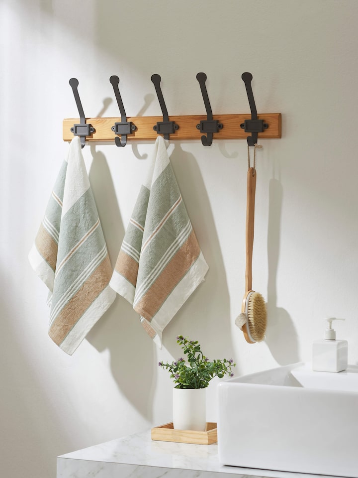 Side view of Aishani green stripe cotton hand towels focusing on the stripe design