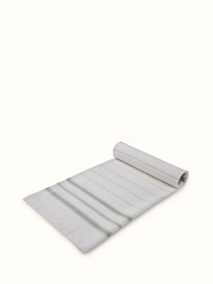 Angled view of Adrita Green Stripe Cotton Bath Towel (M), showing the full length and green stripes on the towel.