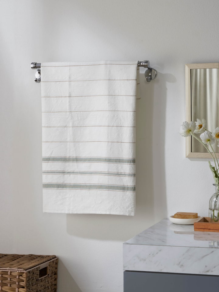 Close-up view of Adrita green cotton bath towel highlighting the striped pattern