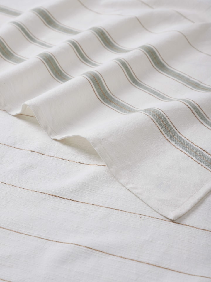 Full view of Adrita green cotton bath towel with striped design and soft fabric