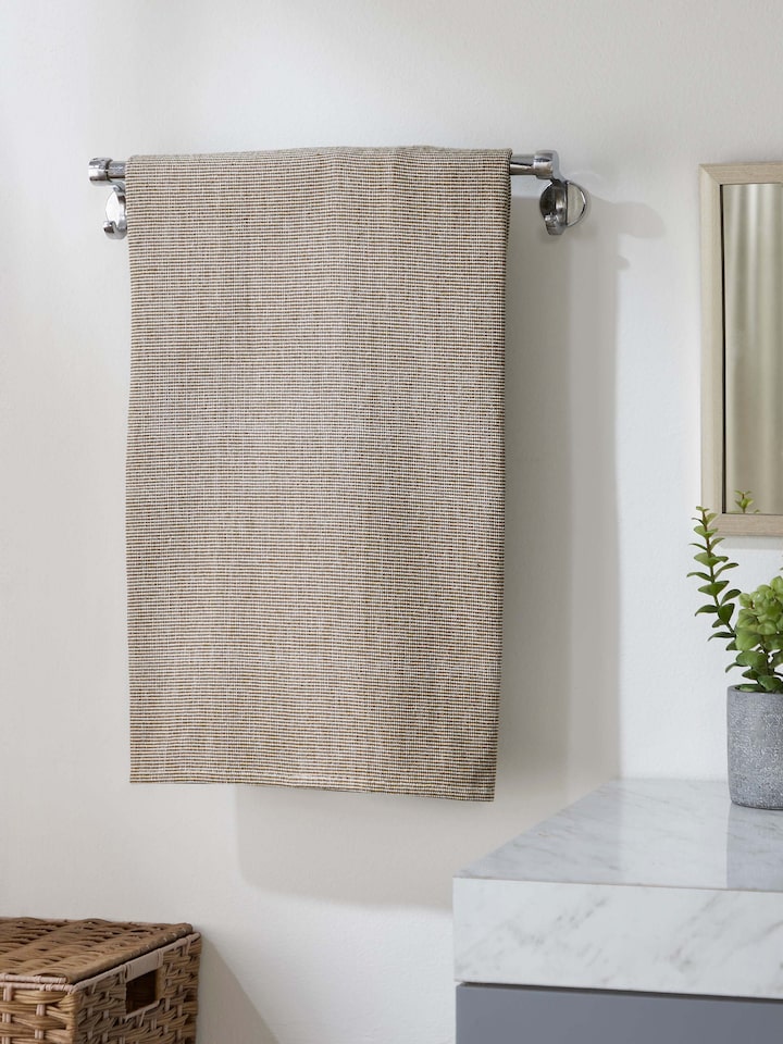 Close-up of Shikara green chambray cotton bath towel (L) highlighting the chambray texture and green color