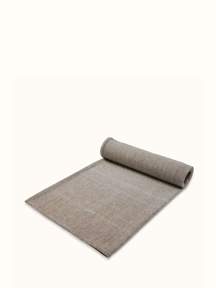 Full view of Shikara green chambray cotton bath towel (L) displayed to show its size, texture, and green chambray fabric