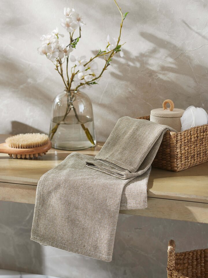 Close-up of Shikara green chambray cotton hand towels (2 pcs) highlighting the chambray fabric texture.