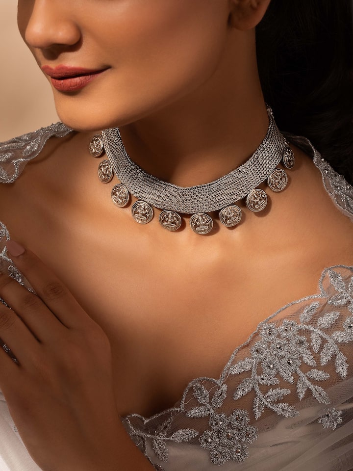 Side view of Silver collar necklace highlighting elegant curves and high-quality metalwork